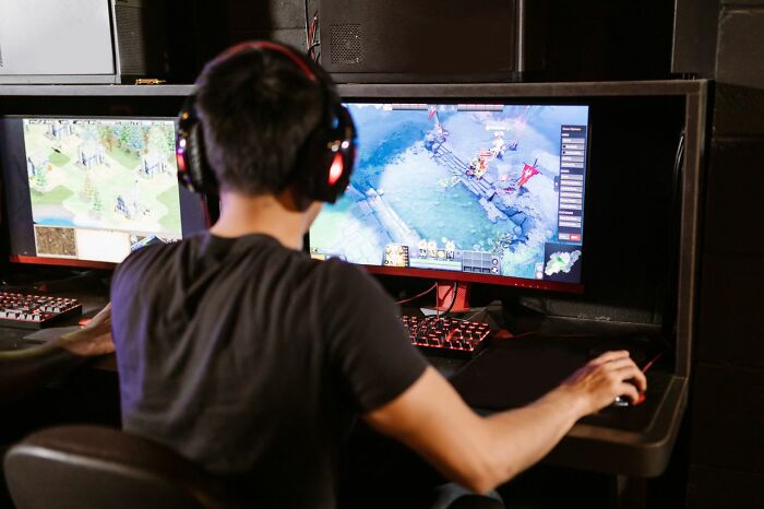 A person playing a video game, illustrating simple joys ruined after becoming mainstream.