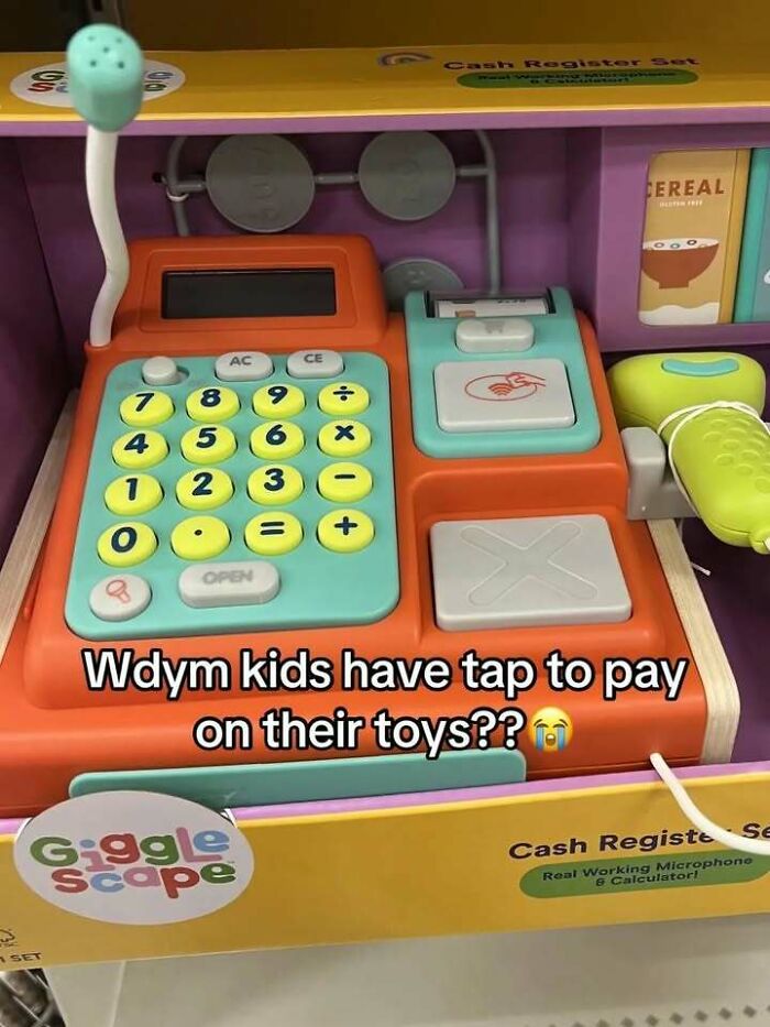 A hilarious toy cash register with a tap to pay feature, adding to a list of edgy and hilarious memes.