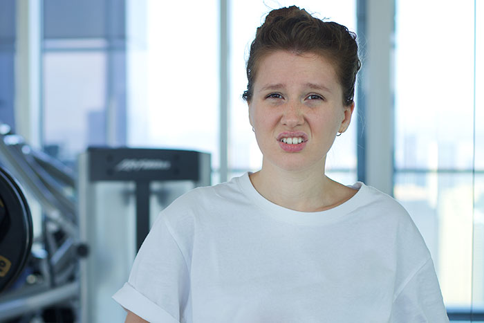 A young woman with a disgusted expression, advocating for accessibility while accused of stealing. A young woman with a disgusted expression, advocating for accessibility while accused of stealing.