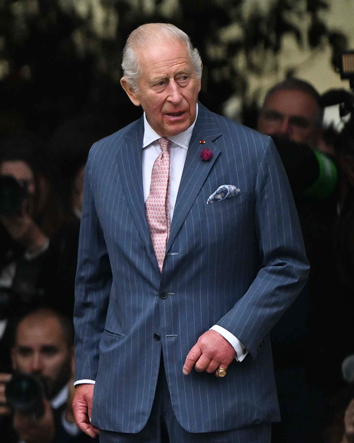 King Charles in a blue pinstripe suit, his controversial letter addressing their UK return.