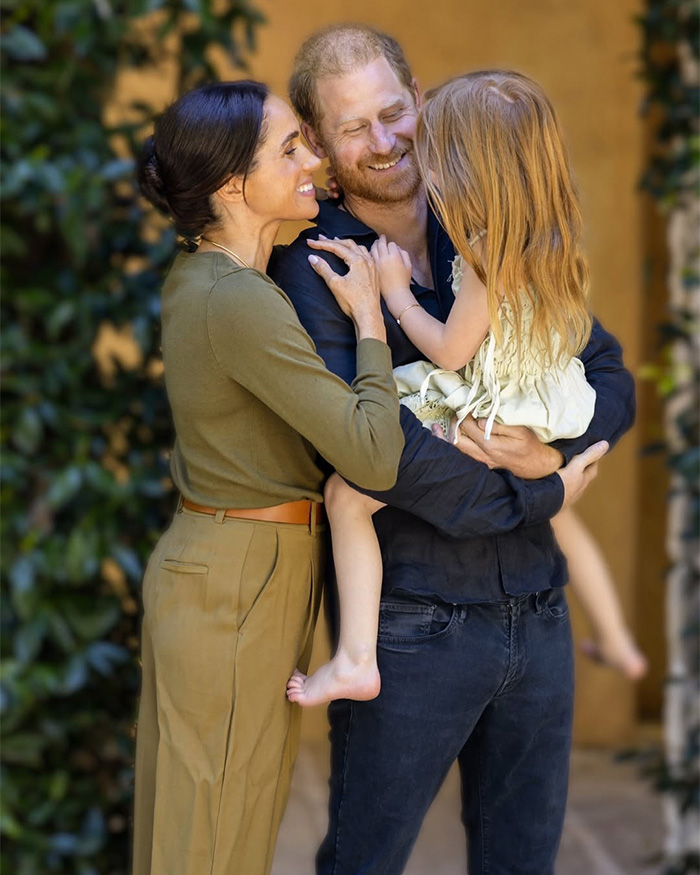 Prince Harry and Meghan Markle with their child, a family moment amidst royal controversy and King Charles' letter.