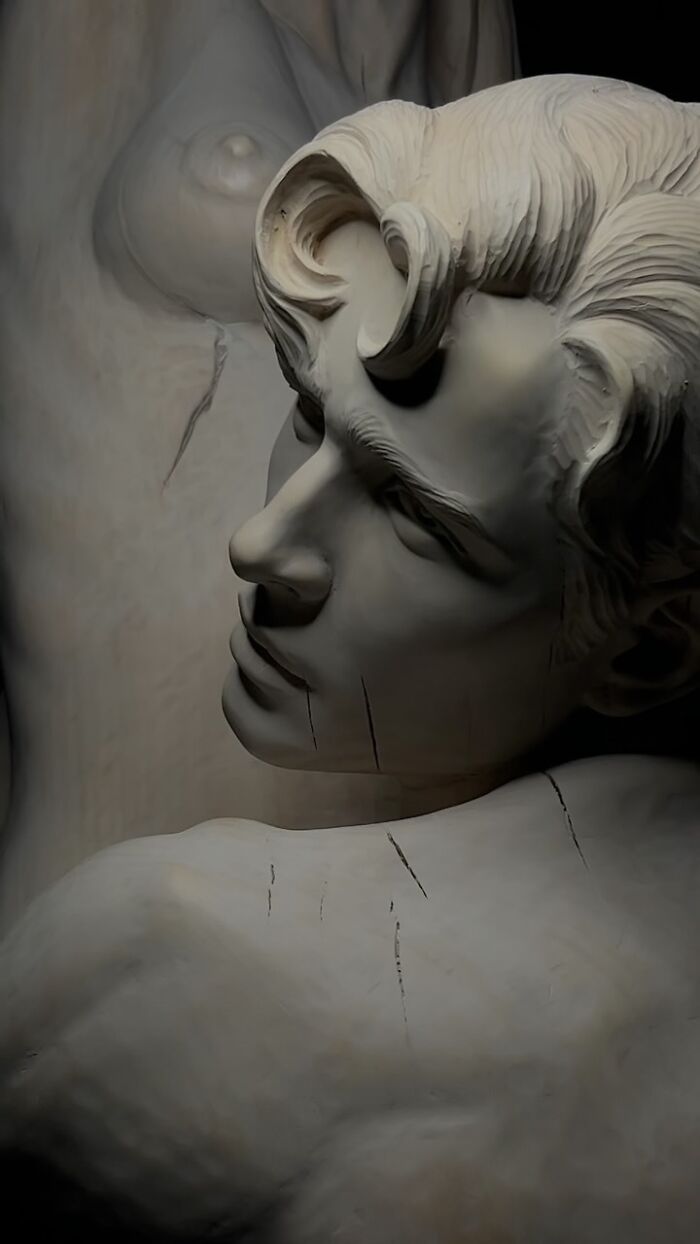 Intricate close-up of a carved wooden face sculpture by a Polish artist