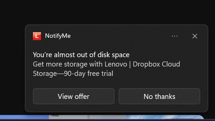 An annoying low disk space notification promoting cloud storage, highlighting terrible product design.