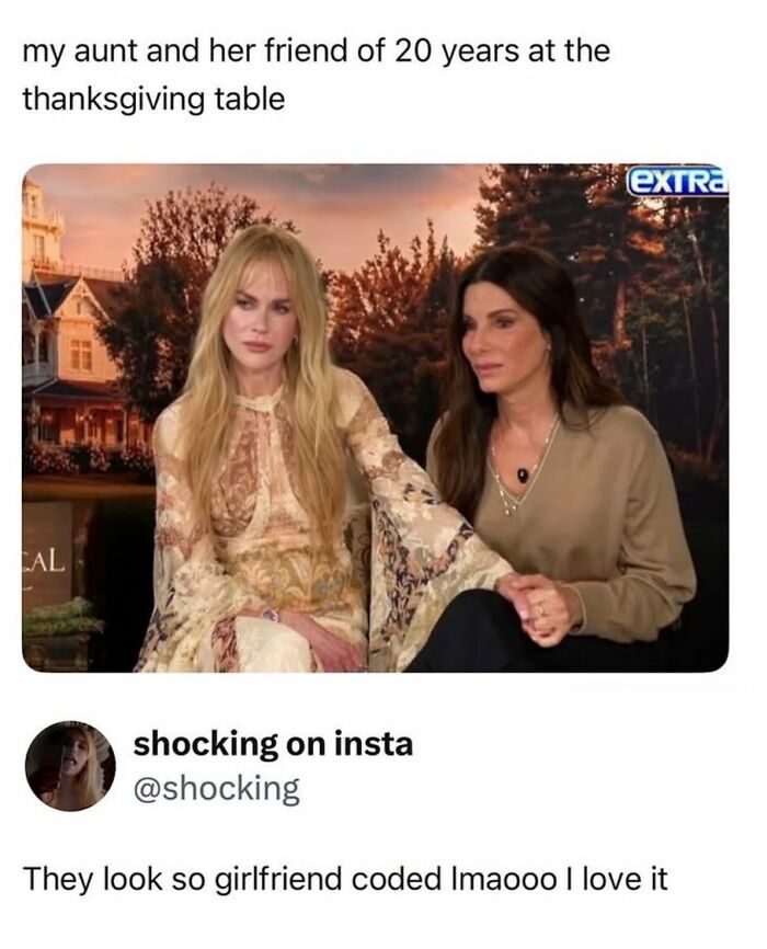 Two women sitting holding hands at Thanksgiving table meme