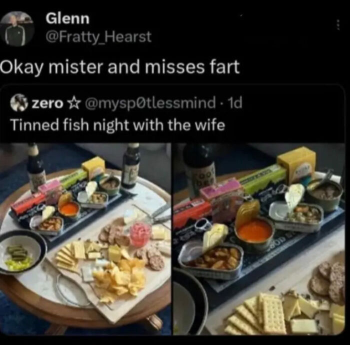 Hilarious photos of a tinned fish night with various canned goods and cheeses on a platter, a unique meal.