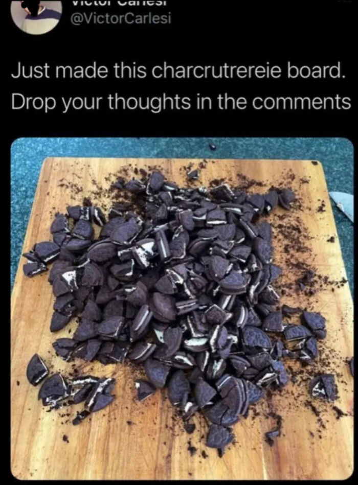 Hilarious photos of a charcuterie board made entirely of broken Oreo cookies, a comical dessert.