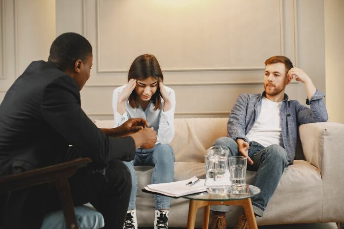 Couple in therapy sessions talking about marriages collapsed