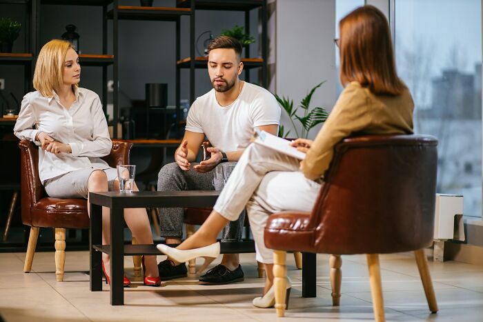 A couple during counseling session, discussing why their marriages collapsed