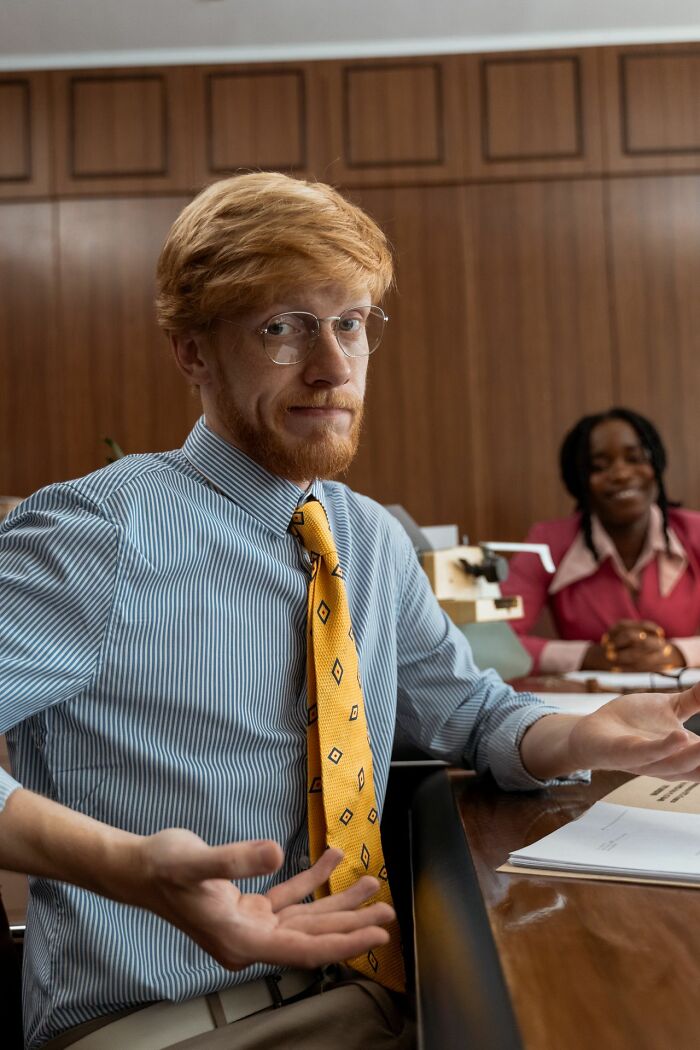 A red-haired man shrugging, illustrating complex reasons marriages collapsed