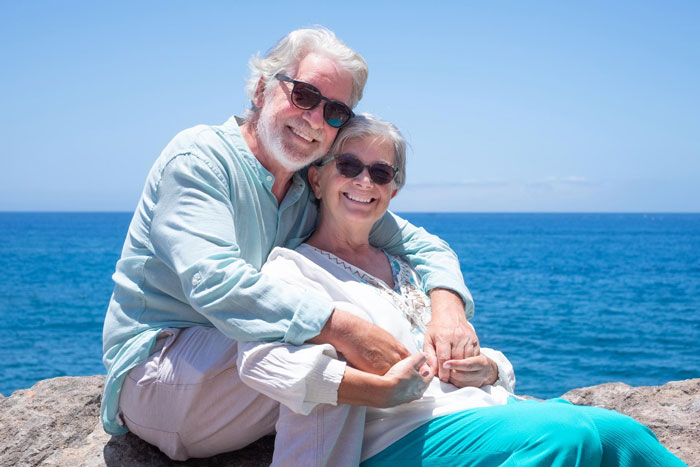 A happy retired couple enjoying life together and managing their inheritance and spending plans. A happy retired couple enjoying life together and managing their inheritance and spending plans.