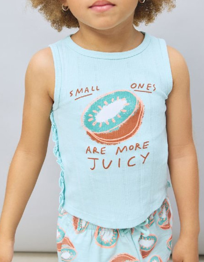 Close-up of a little girl wearing a retail giant t-shirt with the terrible message slogan: Small ones are more juicy. Close-up of a little girl wearing a retail giant t-shirt with the terrible message slogan: Small ones are more juicy.