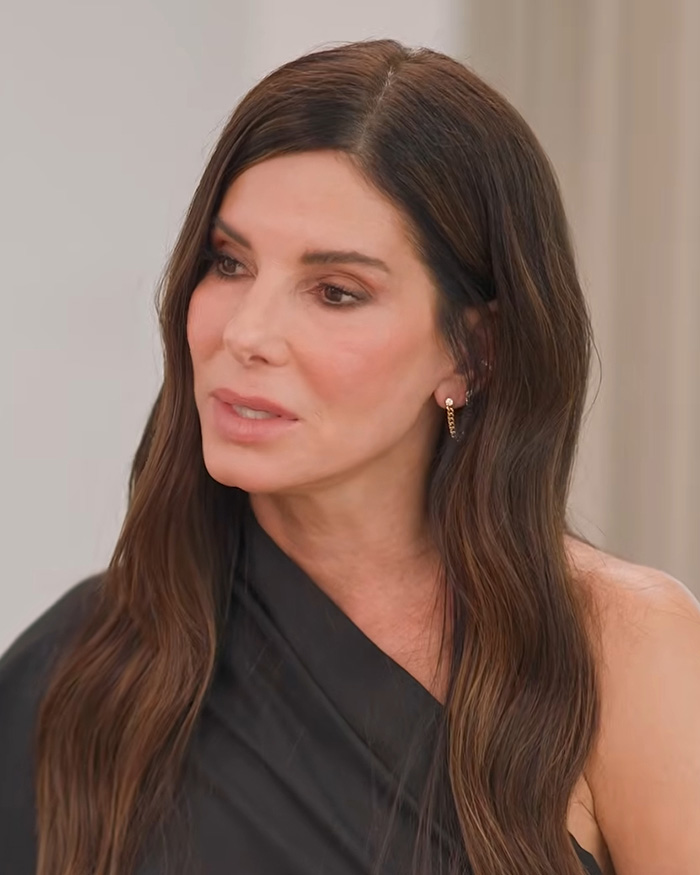 Close-up of Sandra Bullock looking thoughtful, reflecting on the extreme measures to keep her son a secret. Close-up of Sandra Bullock looking thoughtful, reflecting on the extreme measures to keep her son a secret.