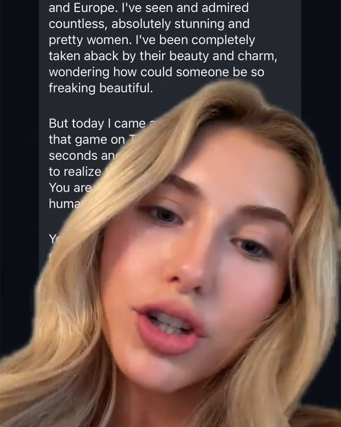 An attractive woman with blonde hair against a blurred background of text, looking away from the camera.