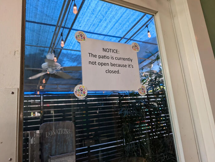 Hilarious photo of a notice sign on a glass door that says the patio is closed, serving funny internet content.