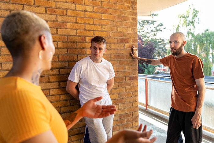 A woman with short hair talks to two men, illustrating the scenario of a friend needing a hot GF and a weight-loss coach. A woman with short hair talks to two men, illustrating the scenario of a friend needing a hot GF and a weight-loss coach.