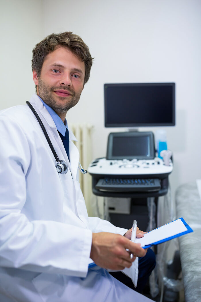Male doctor with stethoscope and medical equipment illustrating sexist treatment in healthcare