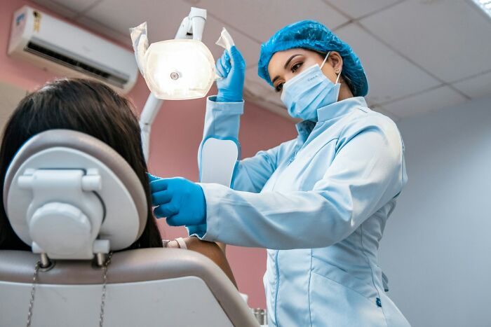 Dentist preparing to examine patient in dental clinic