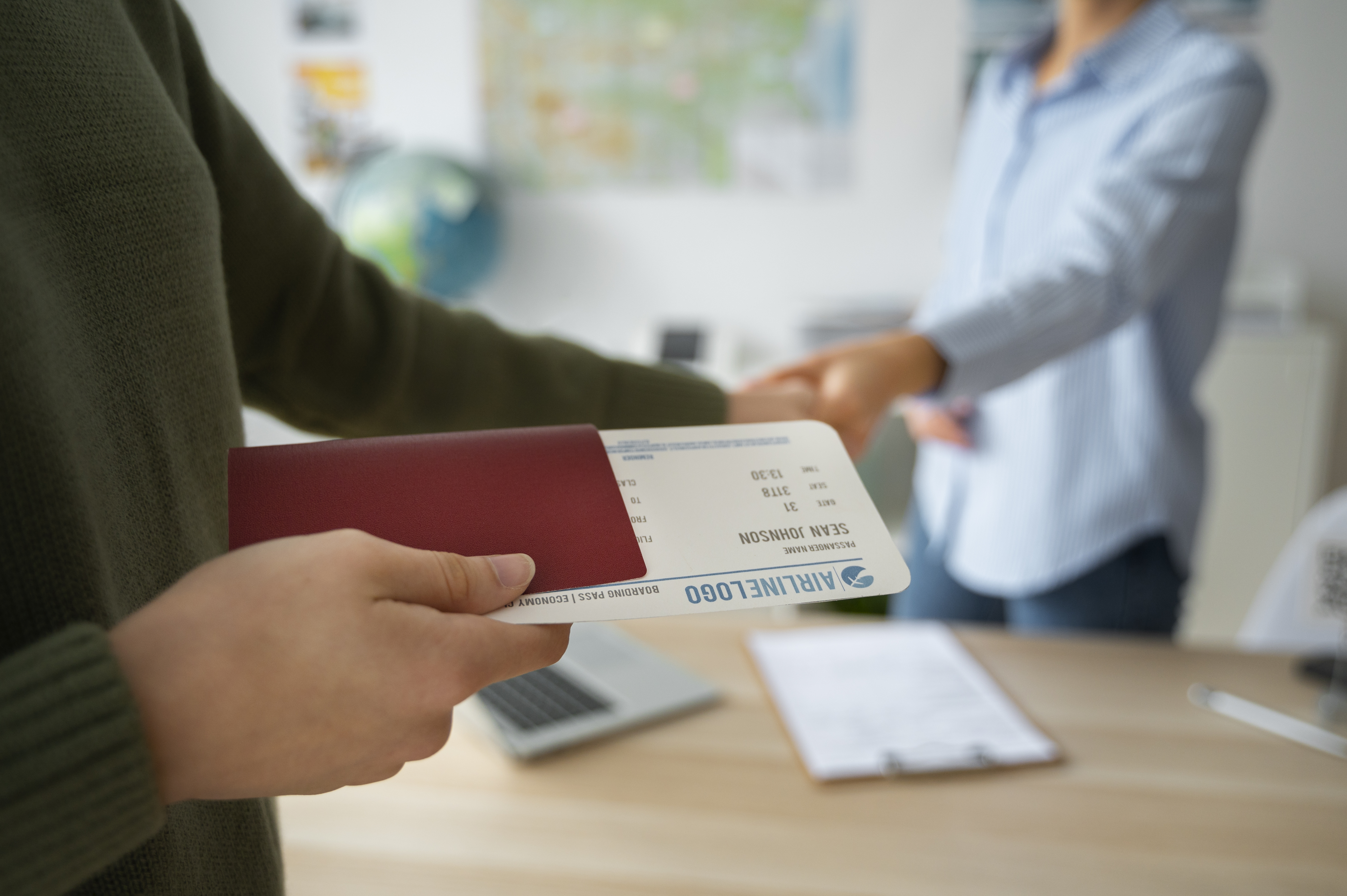 An illustration of a traveler holding a passport and boarding pass to stay abroad with twin newborns. An illustration of a traveler holding a passport and boarding pass to stay abroad with twin newborns.