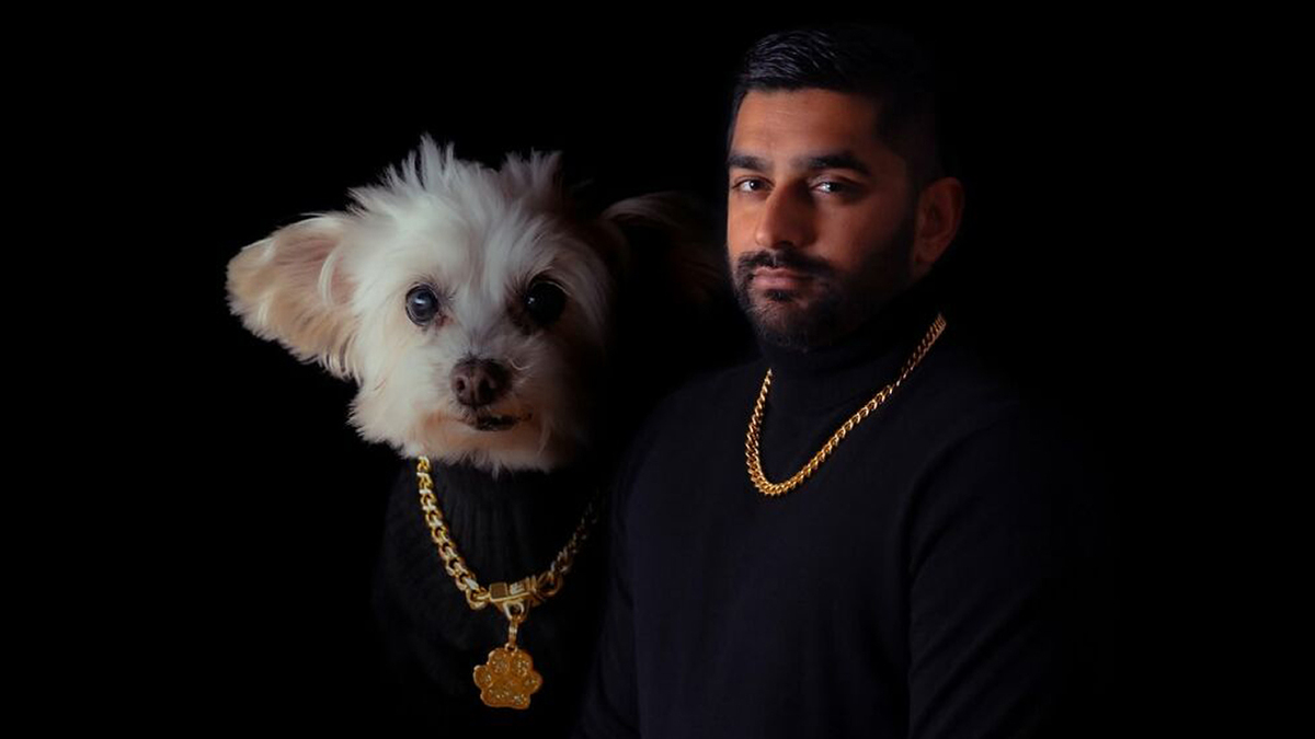 A man and his dog in silly, quirky portraits. Both wear black turtlenecks and gold chains against a dark background.