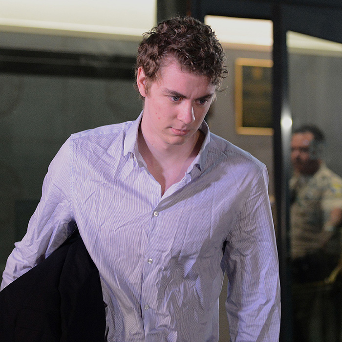 Brock Turner in a light blue shirt walking with a serious expression. Brock Turner in a light blue shirt walking with a serious expression.