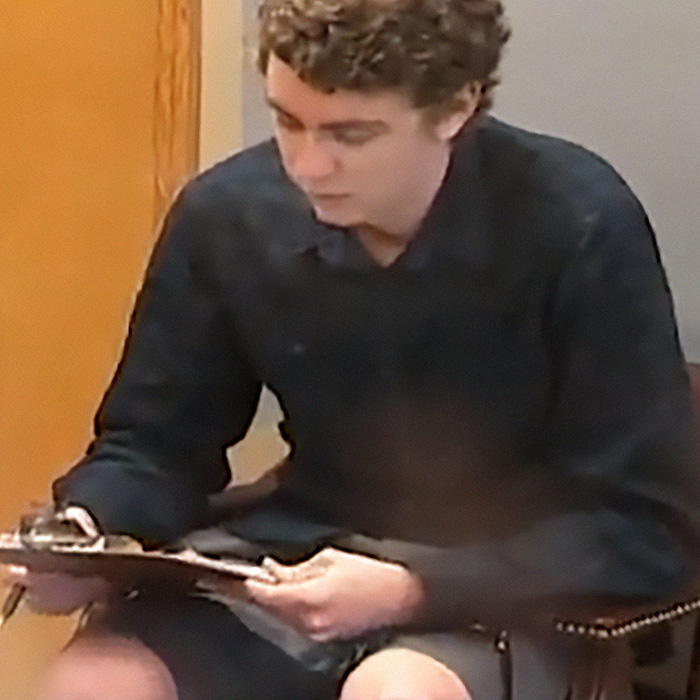 Brock Turner sitting in a courtroom during his trial Brock Turner sitting in a courtroom during his trial