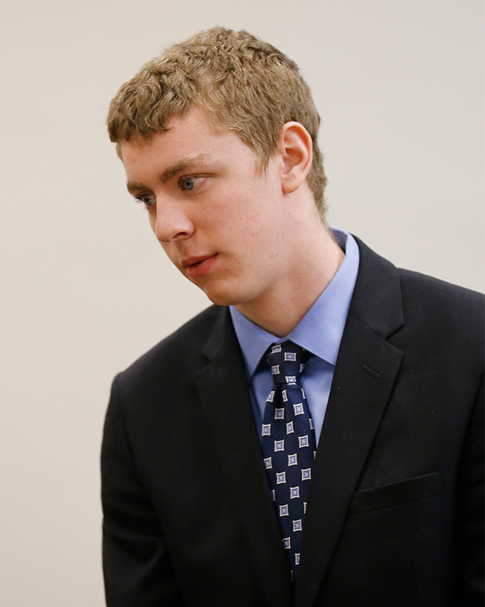 Brock Turner looking downward during a court appearance in a dark suit. Brock Turner looking downward during a court appearance in a dark suit.