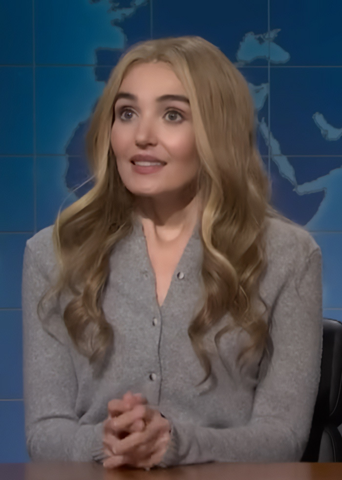 SNL star Sarah Sherman mocking Sydney Sweeney's controversial betting ad with a hilarious parody, wearing a grey cardigan. SNL star Sarah Sherman mocking Sydney Sweeney's controversial betting ad with a hilarious parody, wearing a grey cardigan.