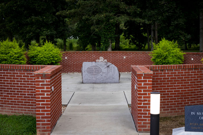 Memorial stone in a brick courtyard, connected to the context of Stephen King's pulled book. Memorial stone in a brick courtyard, connected to the context of Stephen King's pulled book.