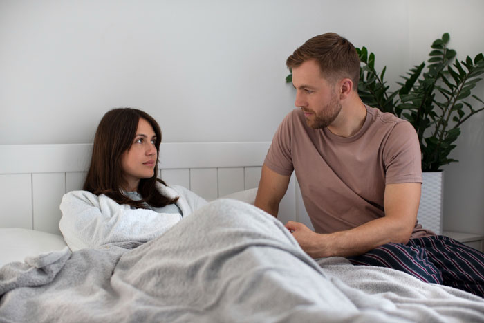 A couple in bed discussing the woman's adult stepdaughter and the years of insults she endured, finally snapping. A couple in bed discussing the woman's adult stepdaughter and the years of insults she endured, finally snapping.