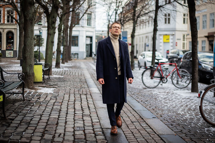 A man walking down a street in winter, representing experiences of subtle sexism