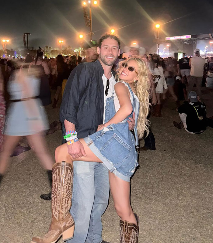 Sydney Sweeney and a man at a lively outdoor event, with netizens zooming in on mysterious marks on her rib and stomach. Sydney Sweeney and a man at a lively outdoor event, with netizens zooming in on mysterious marks on her rib and stomach.