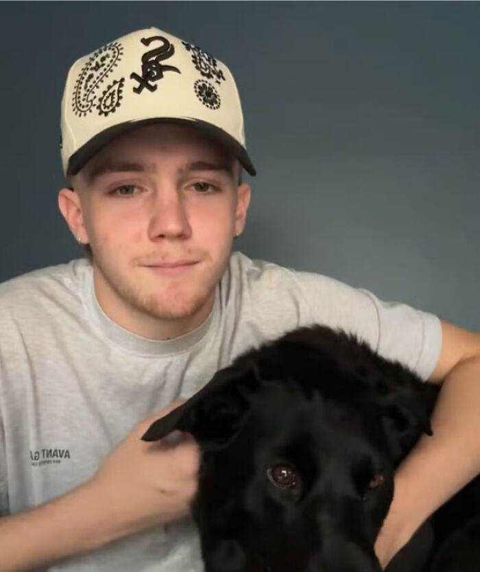 Teen with a dog, reflecting on his decision to quit vaping after a health scare. Teen with a dog, reflecting on his decision to quit vaping after a health scare.