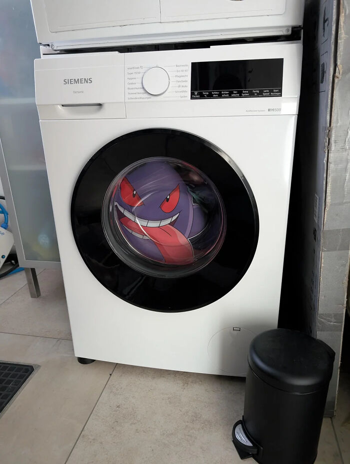 Hilarious photo of a Gengar Pokemon plush toy in a washing machine, showcasing funny internet content.