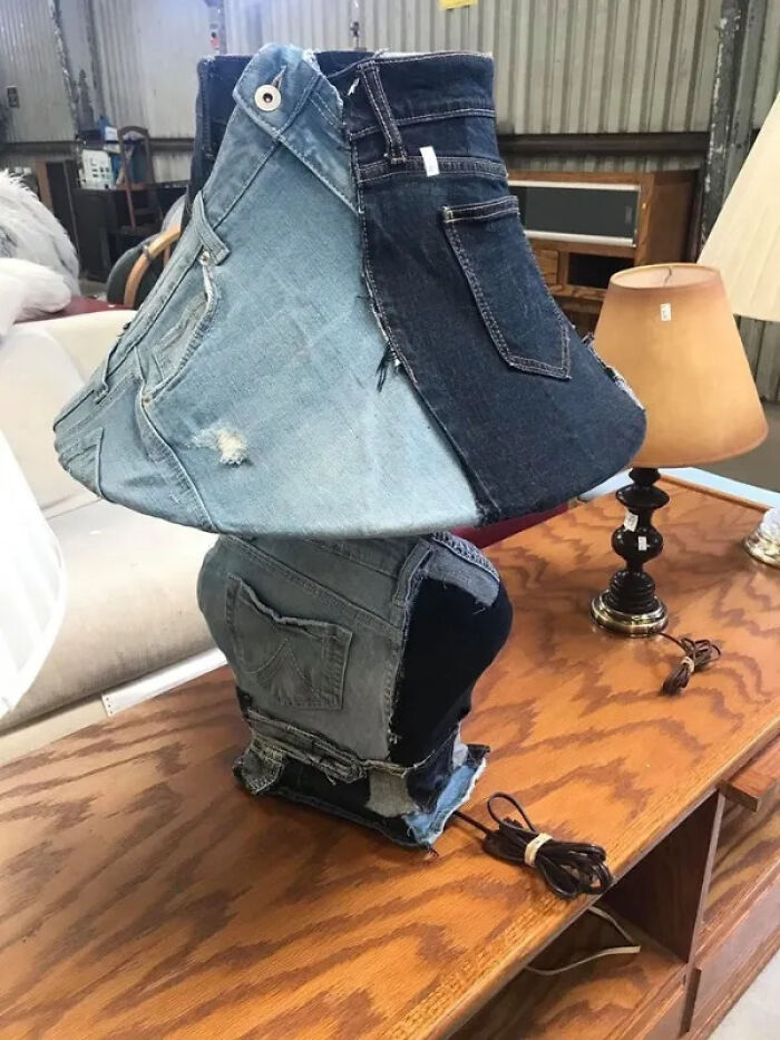 A creative and unhinged secondhand lamp made from multiple pairs of old denim jeans, a unique find.