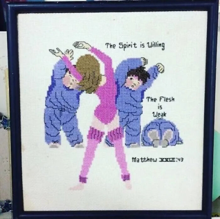 Cross-stitch art depicting a woman exercising with two figures falling, a cursed treasure secondhand find.