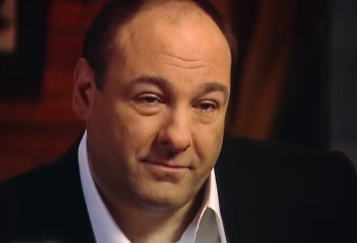 Close-up of James Gandolfini as Tony Soprano looking thoughtful, presenting new facts about television history