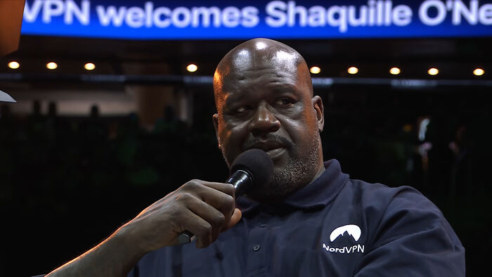 Shaquille O'Neal speaking at an event, presenting interesting new facts