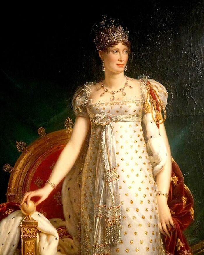 Classic oil portrait of a queen in a gold-detailed gown with new facts