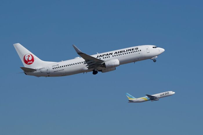 Japan Airlines plane taking off against a blue sky, demonstrating new facts about aviation