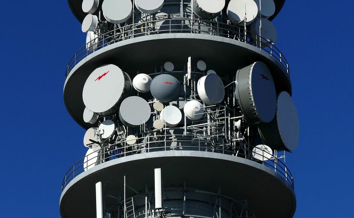 Broadcasting tower with many satellite dishes, introducing new facts about modern telecommunication systems