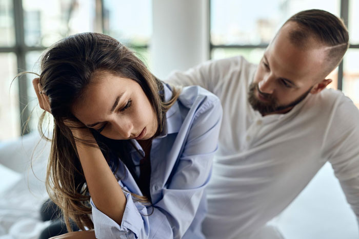 A woman ending a toxic relationship at 33, while her dad expects a grandchild. She looks stressed. A woman ending a toxic relationship at 33, while her dad expects a grandchild. She looks stressed.