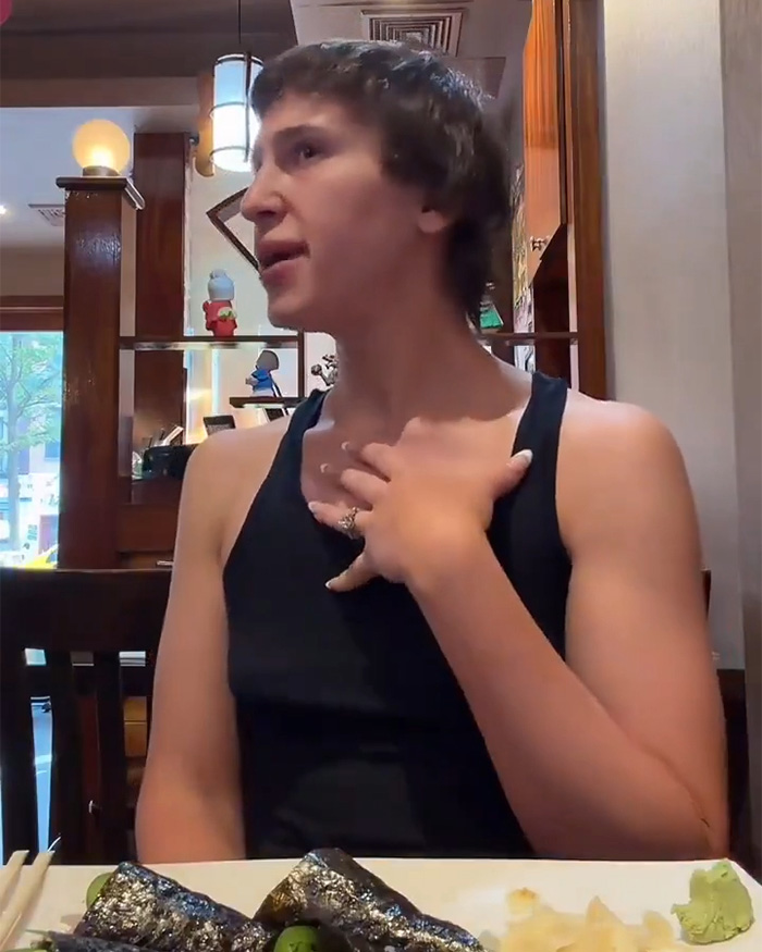 Trans woman in a Japanese restaurant, central to a cultural debate.