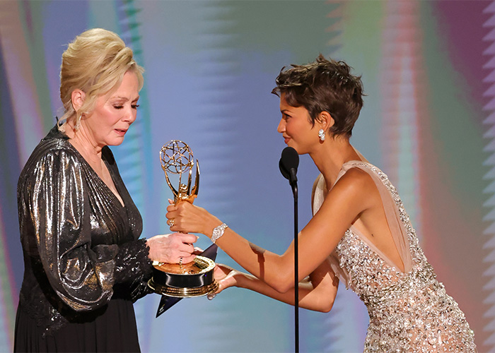 Two women on stage, one presenting an Emmy to the other, highlighting the alarming trend amongst Emmy Winners. Two women on stage, one presenting an Emmy to the other, highlighting the alarming trend amongst Emmy Winners.
