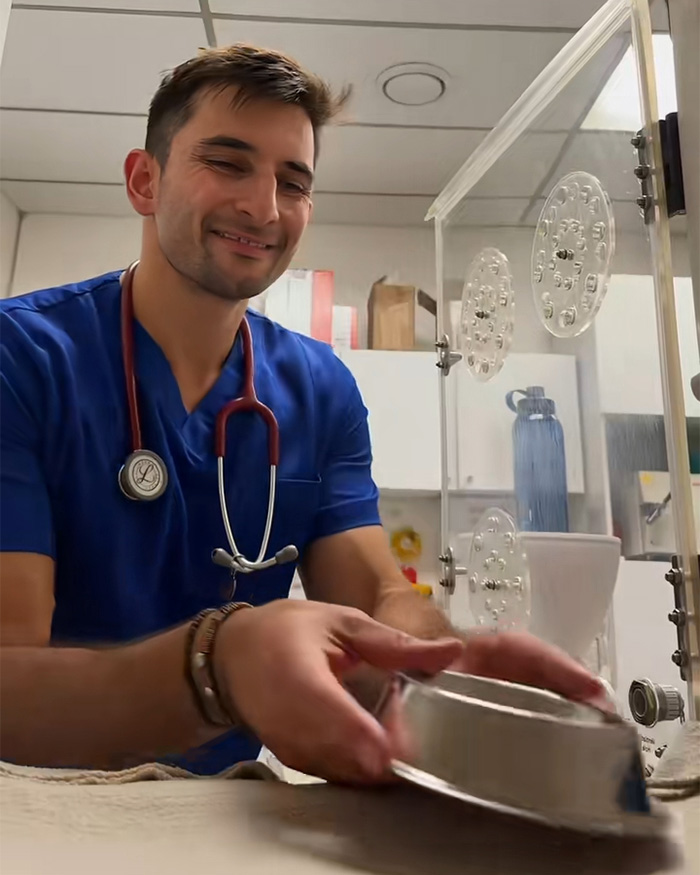 Smiling vet shares pet names with a stethoscope around his neck. Smiling vet shares pet names with a stethoscope around his neck.