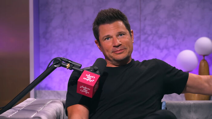 Nick Lachey talking into a microphone, sharing his celebrity encounter story