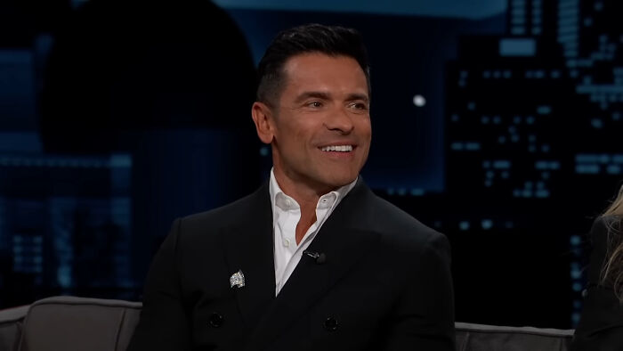 Actor Mark Consuelos smiling during a late-night show, popular in celebrity encounters