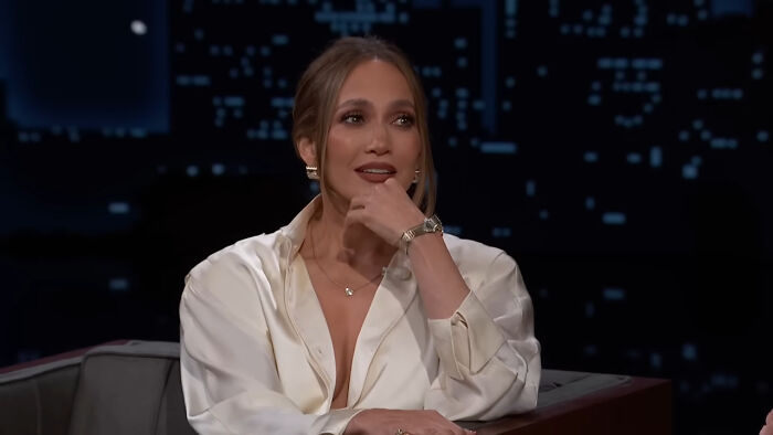 Singer and actress Jennifer Lopez resting her chin on her hand during a late-night talk show appearance