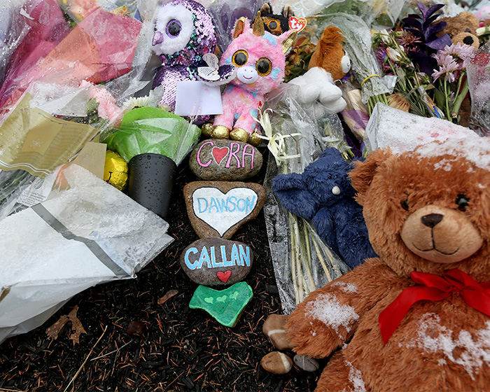 A memorial with stuffed animals and rocks bearing names Cora, Dawson, Callan, linked to Lindsay Clancy's case. A memorial with stuffed animals and rocks bearing names Cora, Dawson, Callan, linked to Lindsay Clancy's case.