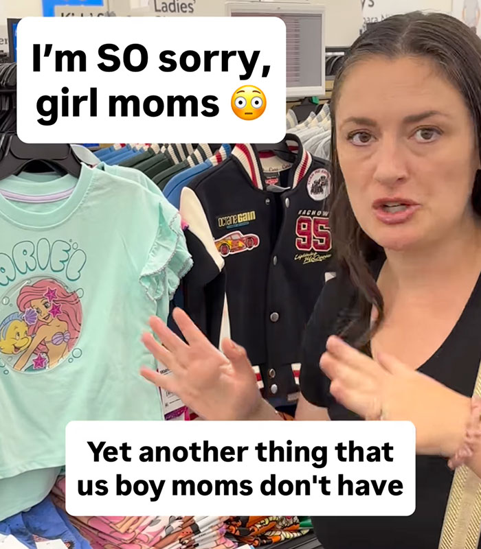 Viral mom in a megastore, gesturing towards girls' t-shirts, discussing the controversy and advocating for change. Viral mom in a megastore, gesturing towards girls' t-shirts, discussing the controversy and advocating for change.