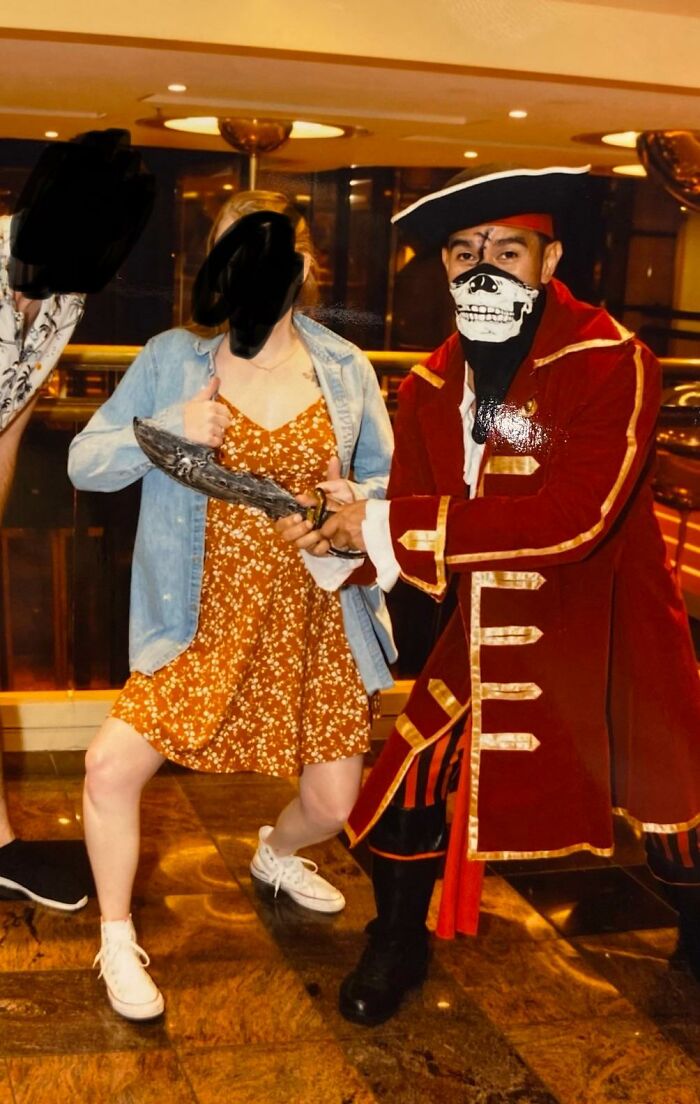 A woman holding a knife that looks like it pierces a pirate, making you look twice.